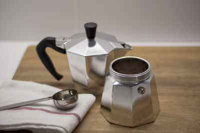 Close-up of coffee maker on table