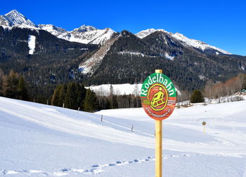 Snow covered landscape against sky