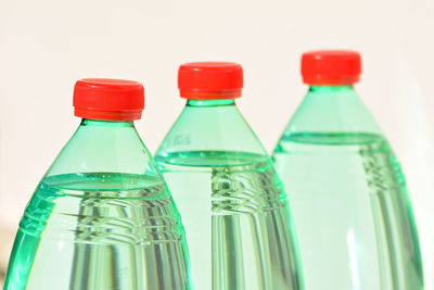 Close-up of glass bottle against white background