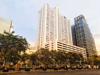 Low angle view of buildings against sky in city