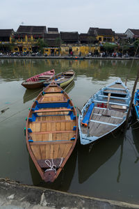 Boats moored in lake