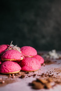 Close-up of pink fruits on table