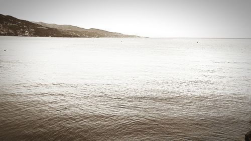 Scenic view of beach against clear sky