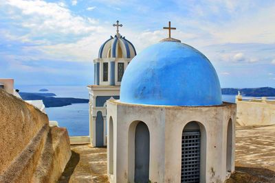 Chapels on promenade against sky