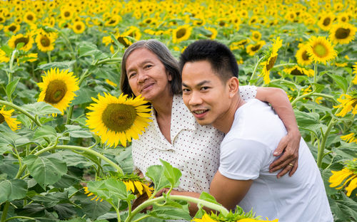 Portrait of smiling woman with son