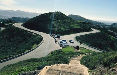 High angle view of road by mountain against sky