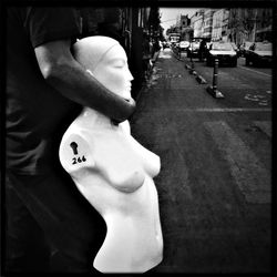 Woman standing on city street