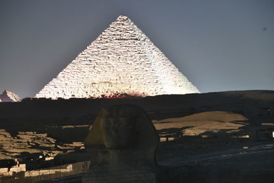 Statue of historic building against clear sky