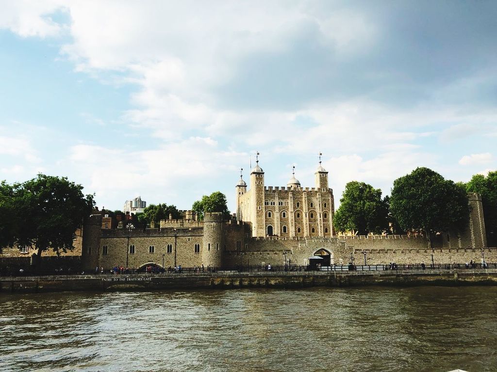 built structure, architecture, water, building exterior, sky, waterfront, cloud - sky, travel destinations, river, building, history, the past, day, tower, nature, travel, tree, tourism, religion, outdoors