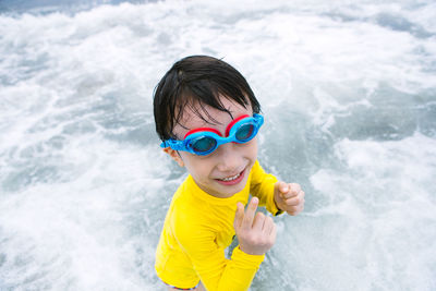 Portrait of smiling boy in water