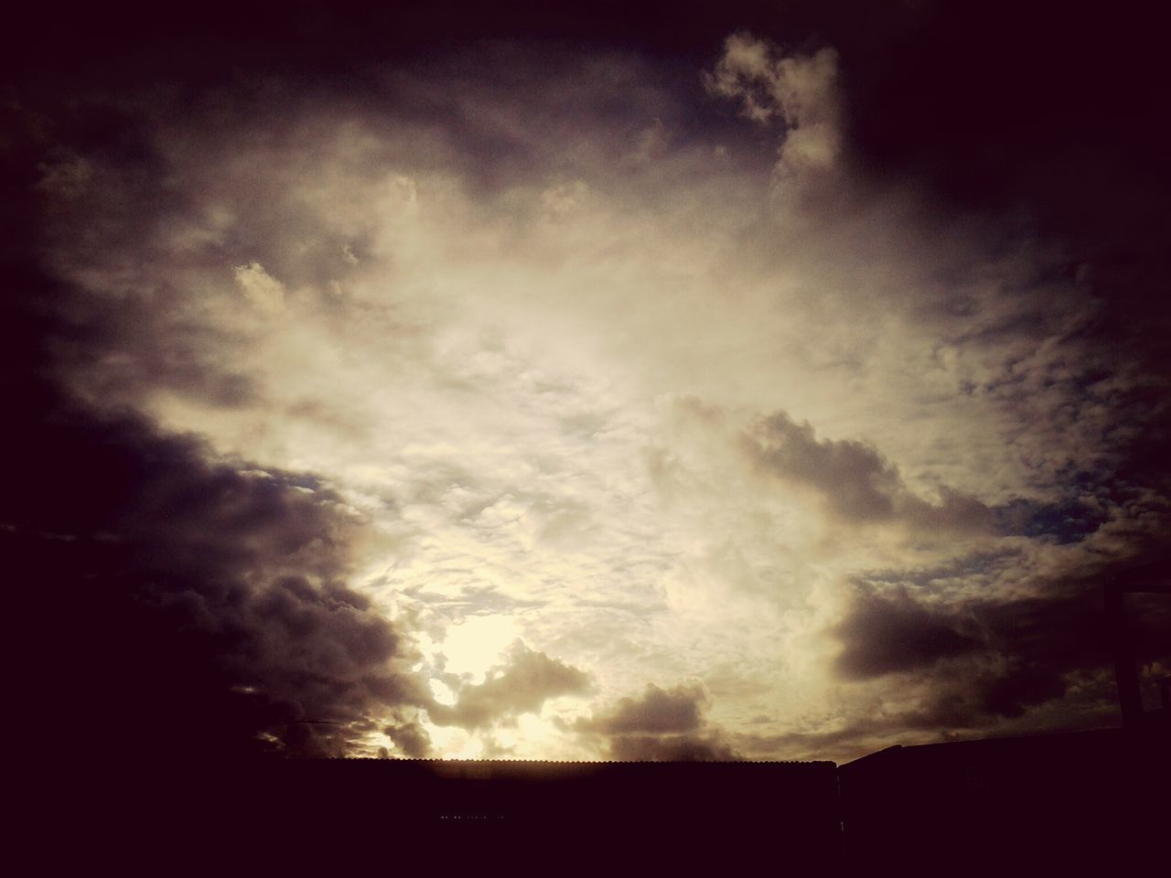 sky, low angle view, cloud - sky, cloudy, silhouette, beauty in nature, scenics, nature, tranquility, tranquil scene, weather, cloud, overcast, dark, storm cloud, dusk, idyllic, cloudscape, outdoors, auto post production filter