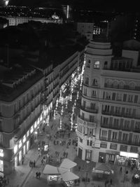 High angle view of illuminated street in city at night