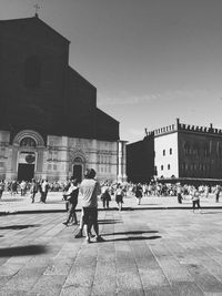 People at town square against clear sky