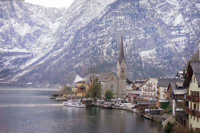 Panoramic view of buildings and snowcapped mountains during winter