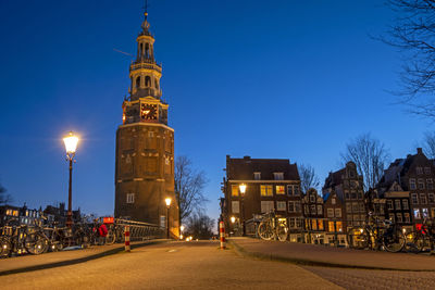 City scenic from amsterdam with the montelbaan tower at sunset in the netherlands 
