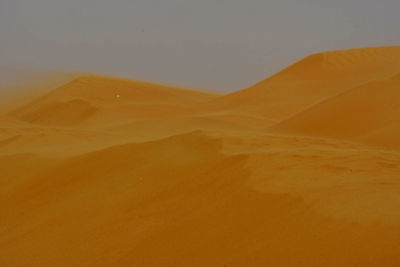 Scenic view of desert against sky