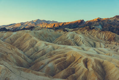 Scenic view of arid landscape against sky