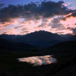Scenic view of mountains against sky during sunset