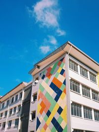 Low angle view of building against blue sky