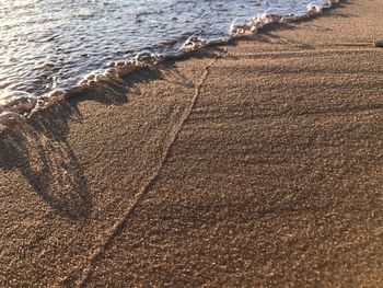 Close-up of sand at beach