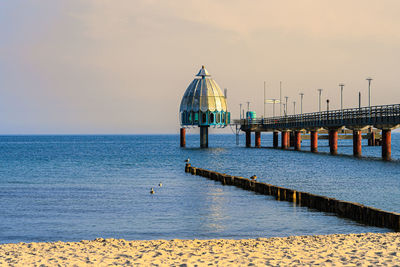 Pier over sea against sky