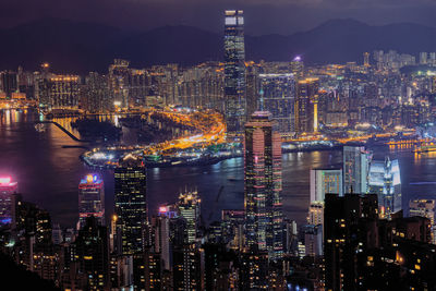 High angle view of illuminated city buildings at night