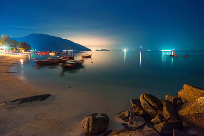 Scenic view of sea against sky at night