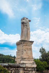 Remains of an antique statue at the ruins of the a ancient agora in athens
