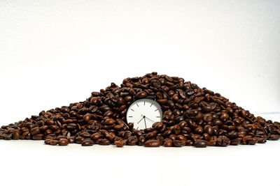 Close-up of coffee beans against white background