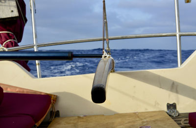 Sailboat sailing in sea against sky