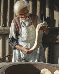 Full length of woman holding bird