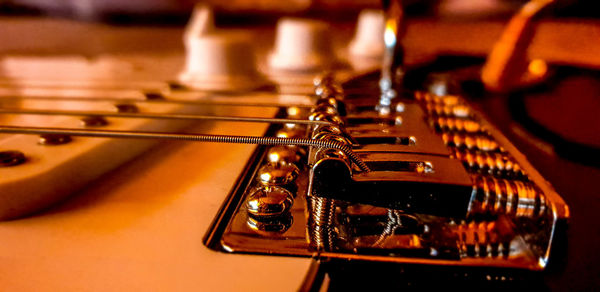 Close-up of guitar on table