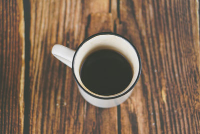 High angle view of black coffee on table