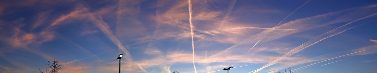 Low angle view of vapor trails in sky