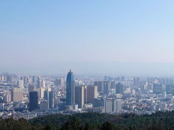 Modern buildings in city against sky