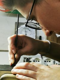 Close-up of man working on table