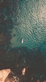 High angle view of rocks in sea