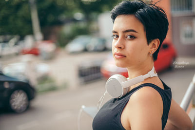 Portrait of beautiful woman on street in city