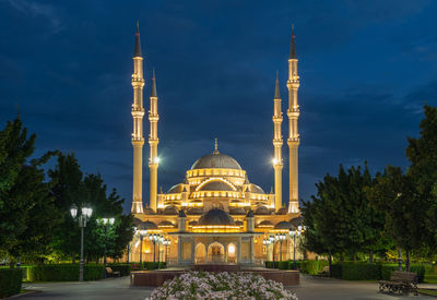 View of illuminated building against sky