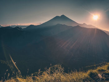 Scenic view of mountains against sky during sunset