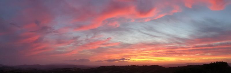 Low angle view of dramatic sky during sunset