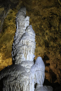 Close-up of statue against rock formation