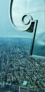 Aerial view of modern city buildings against sky