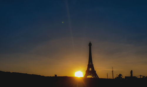 Silhouette of tower during sunset