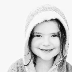 Portrait of young woman against white background