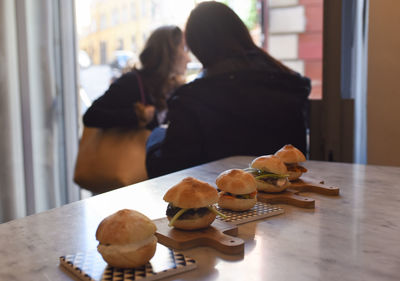 Rear view of people on table