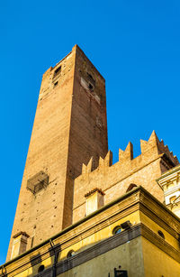 Low angle view of historical building against blue sky