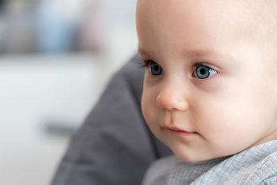 Close-up of cute boy looking away