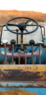 Close-up of rusty metal against sky