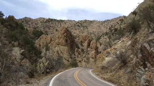 Panoramic view of road amidst mountains against sky